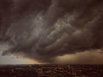 High angle view of cityscape against cloudy sky