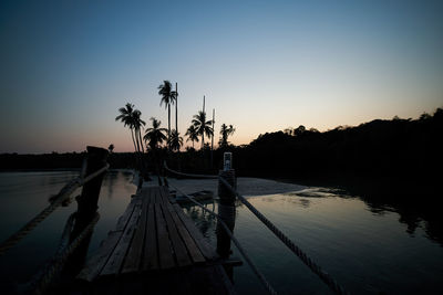 Scenic view of lake against sky at dusk