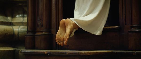 Low section of woman standing at home