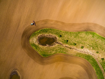 Aerial view of tractor on agricultural field