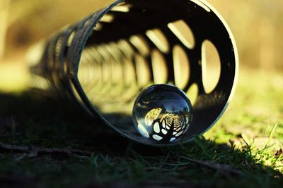 Close-up of crystal ball on field
