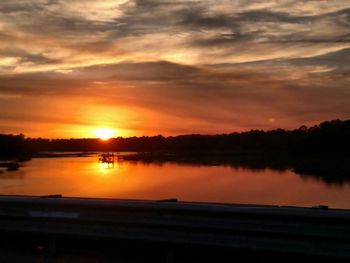 Scenic view of sunset over lake