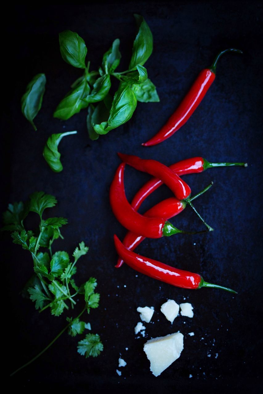 CLOSE-UP OF RED CHILI PEPPER ON TABLE