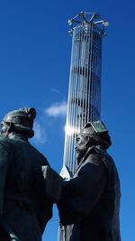 Low angle view of building against blue sky