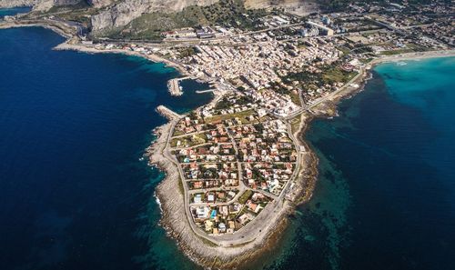 High angle view of sea and cityscape