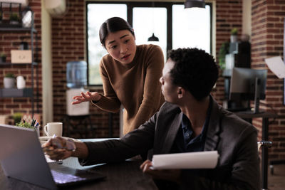 Business colleagues working in office