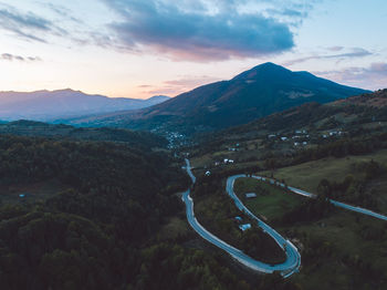 Scenic view of mountains against sky during sunset