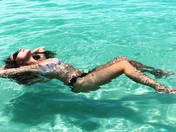 Woman swimming in pool