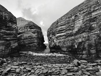 View of rocks against cloudy sky