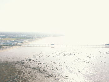 Scenic view of sea against clear sky during winter