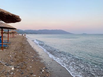 Scenic view of sea against clear sky during sunset