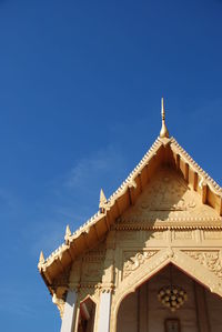 Low angle view of temple against blue sky