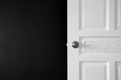 Close-up of door knob on white door