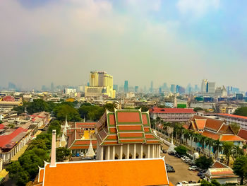 High angle view of buildings in city against sky