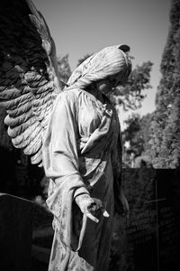 Low angle view of angel statue against clear sky