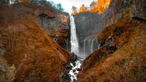 Scenic view of waterfall in forest during autumn