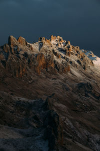 Rock formation on land against sky