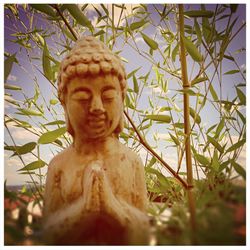 Low angle view of buddha statue