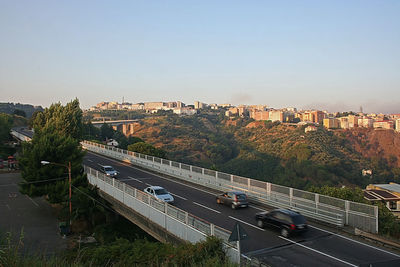 High angle view of bridge in city against clear sky