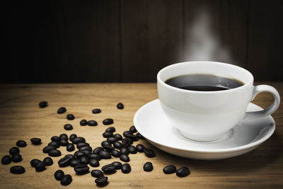 Close-up of coffee cup on table