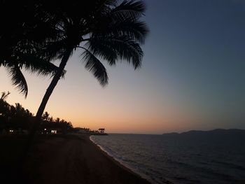 Scenic view of sea against clear sky at sunset
