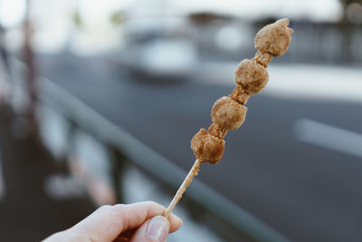 Close-up of hand holding ice cream