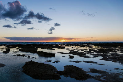 Scenic view of sea against dramatic sky