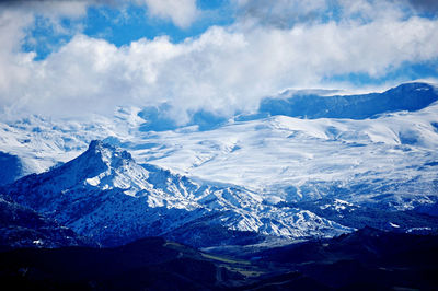 Scenic view of snowcapped mountains against sky