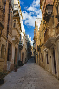 Narrow pathway along built structures