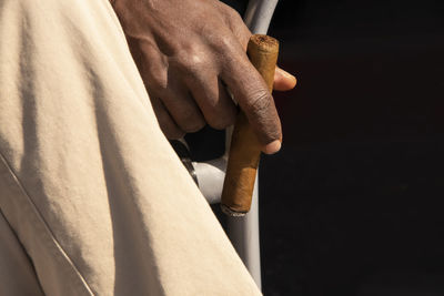 Close-up of man holding hands