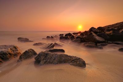 Scenic view of sea against sky during sunset