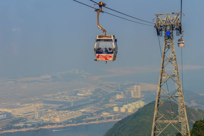 Overhead cable car against sky