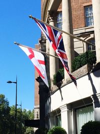 Low angle view of flag against sky