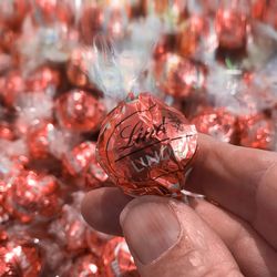 Close-up of hand holding christmas decoration