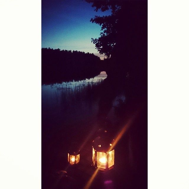 copy space, reflection, water, clear sky, lake, illuminated, transfer print, tranquility, tree, silhouette, auto post production filter, tranquil scene, sky, scenics, night, nature, beauty in nature, dusk, no people, dark