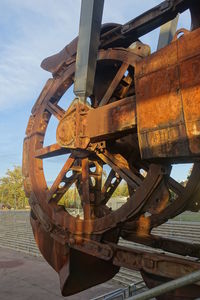 Close-up of rusty train against sky