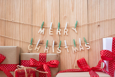 Christmas decorations on table against wall