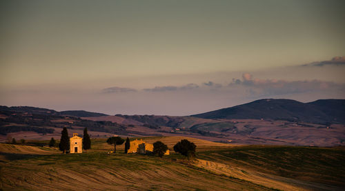 View of fields against mountain range