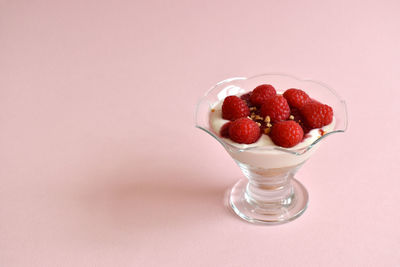 Close-up of strawberries in glass on table