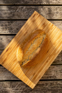 High angle view of bread on cutting board