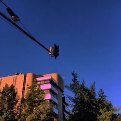 Low angle view of street light against clear sky