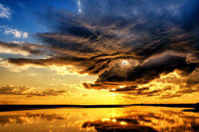 Scenic view of dramatic sky during sunset