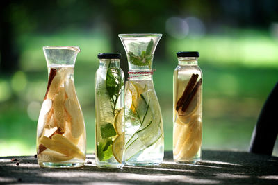 Close-up of drinking glasses on table