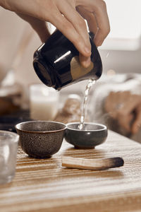 Cropped hand of man washing hands