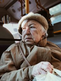 Portrait of man sitting outdoors