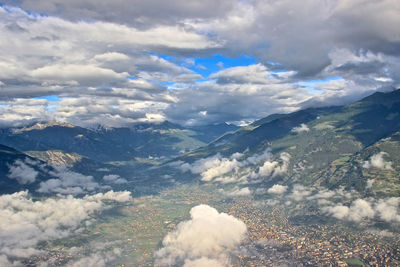 Aerial view of clouds over landscape against sky