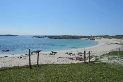 Scenic view of sea against clear blue sky