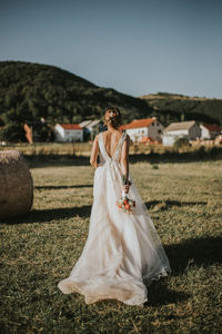 Rear view of woman with umbrella