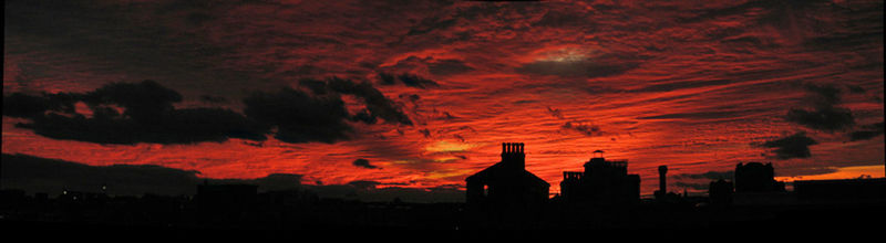 Silhouette of built structure against dramatic sky