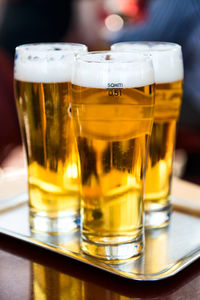 Close-up of beer glass on table